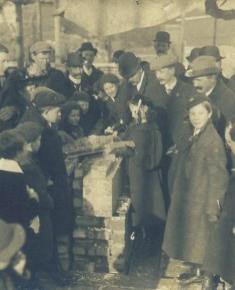 Free Church archive - small girl laying initialed brick on south side of church 25 March 2011