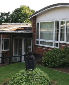 Mother and Child II sculpture by Naomi Blake showing position of nearby two buildings