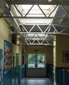 Corridor with skylights and barrel-shaped metal frame