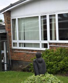 Mother and Child II sculpture by Naomi Blake located outside Infant school