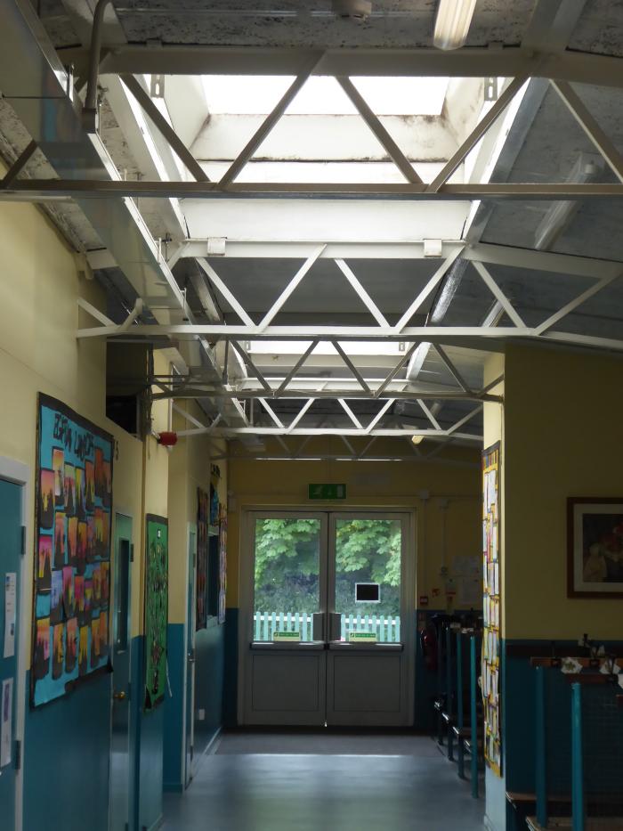 Corridor with skylights and barrel-shaped metal frame